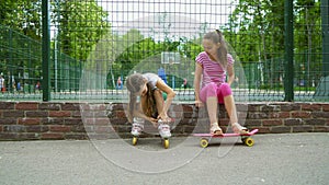 Two girls active passtime in park