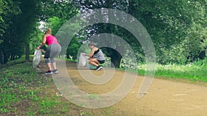 Two girls on back doing plogging