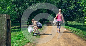 Two girls on back doing plogging