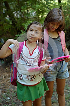 Two girls with backpacks