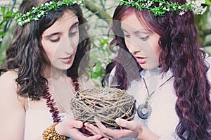 Two Girls with bird nest