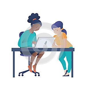 Two girls, black and Caucasian working on laptop