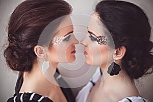 Two girls with black and white fantasy make-up photo