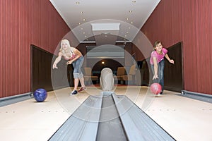 Two Girls Bowling