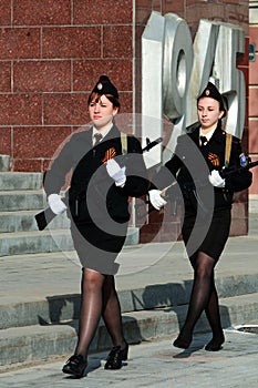 Two girls cadets with weapons photo