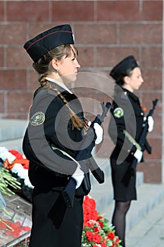 Two girls cadets with weapons photo