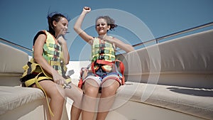 Two girls dancing on a yacht