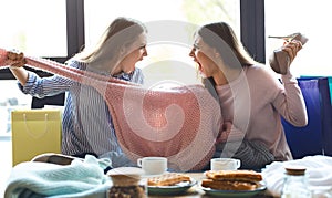 Two girls fighting over pink sweater and screaming on each other