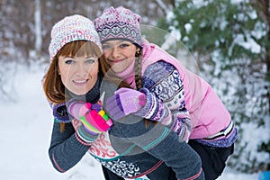 Two girls having fun in winter