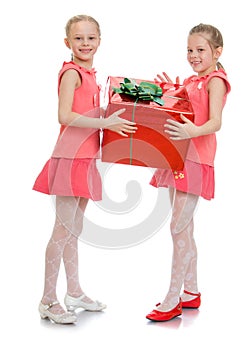 Two girls hold the gift