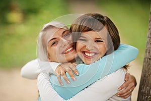 Two girls hugging