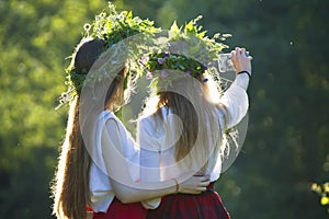 Two girls on Ivan Kupala in embroidered shirts