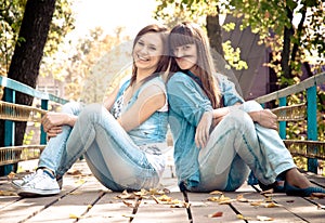 Two girls joking with hair