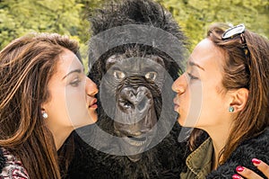 Two Girls kissing an astonished Gorilla
