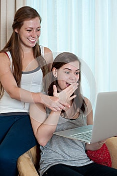 Two girls looking at a lap top