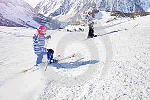 Two girls mountain ski in the mountains track