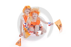 Two girls in orange outfit cheer