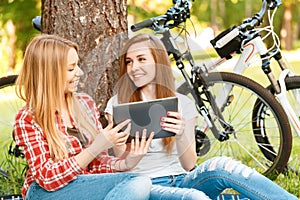 Two girls on a picnic with bikes