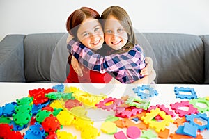 Two girls playing lego