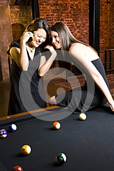 Two girls at pool table