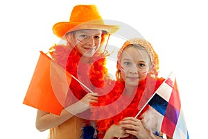 Two girls posing in orange outfit