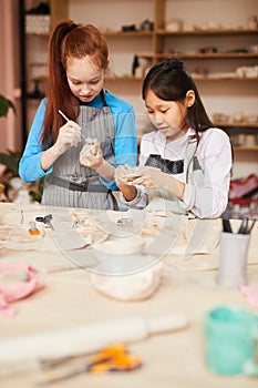 Two Girls in Pottery Workshop