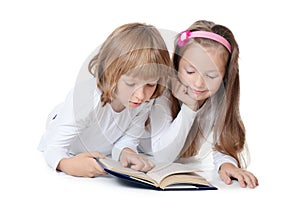Two girls read the book