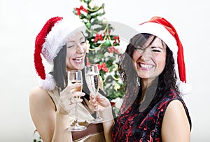 Two girls in red hats have fun