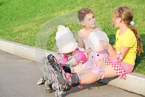 Two girls in roller skates eating