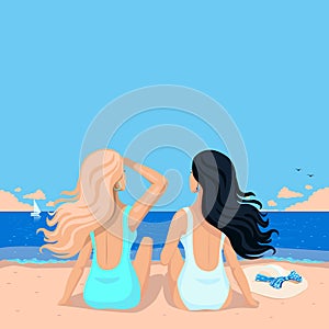 Two girls are sitting on the beach in swimsuits and looking at the sea