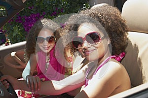 Two girls sitting in a car