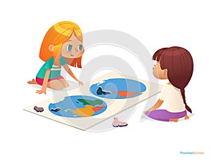 Two girls sitting on floor and trying to assemble world map puzzle.