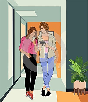 Two girls standing in modern office corridor.