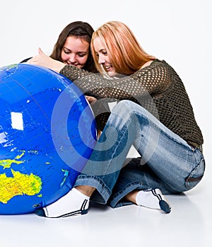 Two Girls Studying the Globe