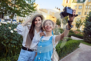 Two girls take a selfie in the park