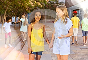 Two girls talking during walk