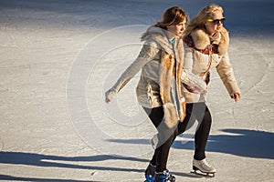 Two girls of teenagers on the ice