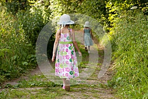 Two girls are on the trail in the forest