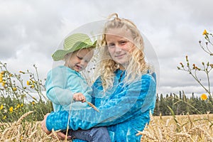 Two girls in a wheat field