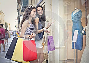Two girls window shopping photo