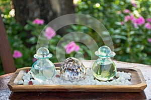 Two glass bottles with aromatic oils photo