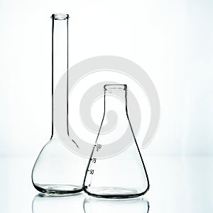 Two glass flasks. Chemical flask.