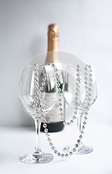 Two glass glasses with beads and champagne, beads tied us up, beads for two, glasses, holiday card,