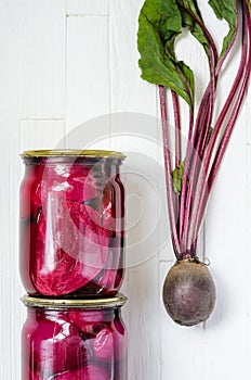 Two glass jars with canned beets