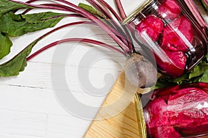 Two glass jars with canned beets