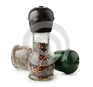 Two glass pepper mills