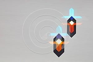 Two glass prism cubes refract light and create a geometric pattern