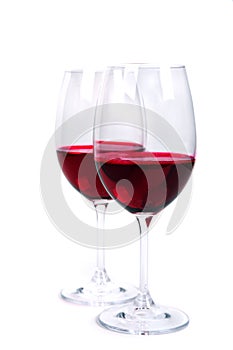 Two glass of red wine on a white background