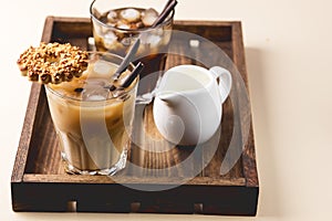 Two Glass of Tasty Cold Coffee on Wooden Tray Black Coffee and Coffee with Milk Refreshing Cold Summer Drink Horizontal Bowl with