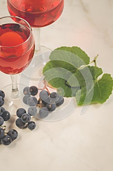 Two glass of wine and grape/two glass of wine and grape on a white marble, copy space